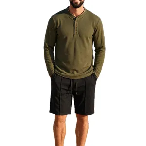 Men's waffle knit long sleeve henley shirt and shorts set casual autumn sportswear outfit.
