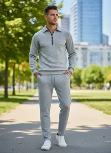 Detail view of men's grey jacquard tracksuit featuring a polo collar and textured fabric.
