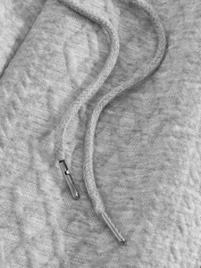Grey jacquard fabric men casual sportswear hoodie drawstring and metal aglet detail closeup