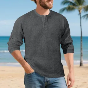 Mens casual solid waffle knit long sleeve Henley shirt textured fabric detail view