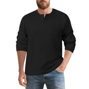 Detailed view of the mens black waffle knit henley shirt showing textured fabric and buttons.