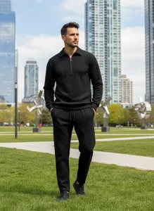 Men black jacquard knit polo sweatshirt and casual pants tracksuit detail view in park setting