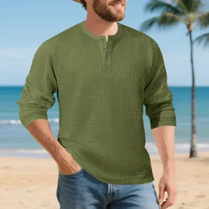 Men's green long sleeve waffle knit henley shirt casual vintage textured top for autumn.