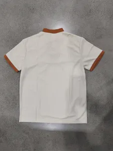 Detail view of the short-sleeve waffle knit shirt in beige and brown contrast design.