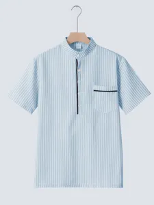 Detailed view showing the light blue striped mandarin collar and chest pocket of the shirt.