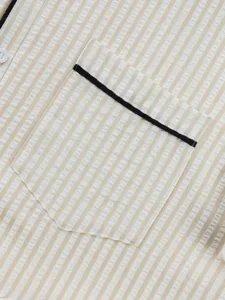 Detail shot of men's summer striped short sleeve shirt showcasing chest pocket and fabric.