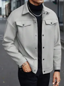 Men's grey fleece jacket detail shot, lapel collar snap button closure front view.