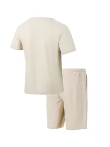 Back detail of casual beige waffle knit short sleeve top and matching shorts two piece set.