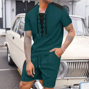 Detailed view of men's casual lace-up short sleeve shirt and matching shorts outfit outdoor.