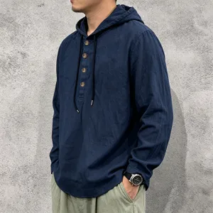 Close-up detail of the men's long sleeve linen hoodie with button closure and drawstring.