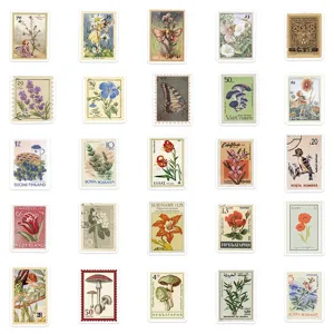 Vintage postage stamp stickers set with botanical art, butterflies, and fairy designs for journals.