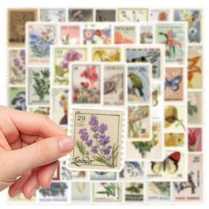 Close-up detail of a vintage lavender stamp sticker held by hand, retro botanical design.