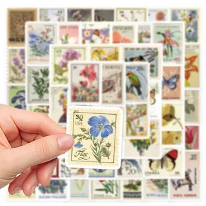 Vintage botanical stamp stickers detail showing flax flower pattern and handmade collage backdrop.