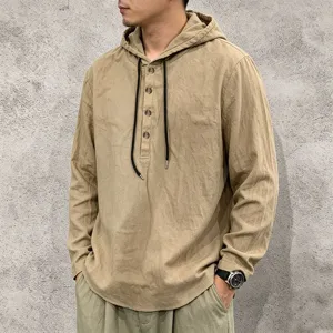 Closeup view of men's casual khaki linen long sleeve hoodie with front buttons and drawstrings.