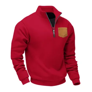 Close-up of the red quarter-zip fleece sweatshirt featuring a contrast brown chest pocket detail.