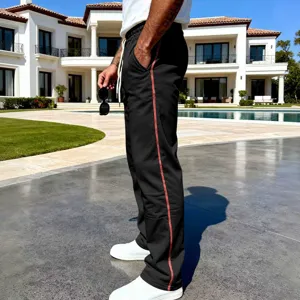 Men's casual loose straight-leg sweatpants with contrast red side seams for spring and autumn wear.