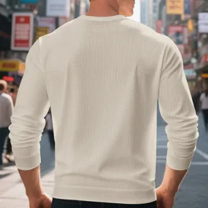 Men's solid color waffle knit long sleeve crewneck t-shirt detail showing soft textured fabric.