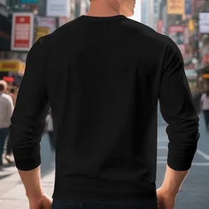 Men's black waffle long-sleeve crewneck t-shirt, comfortable casual solid color fashion top.