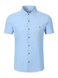 Light blue linen blend short sleeve shirt detail, turn-down collar and chest pocket.