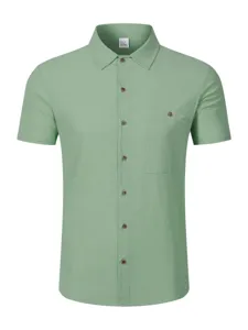 Light green linen blend short sleeve button up shirt detailed view collar and chest pocket.