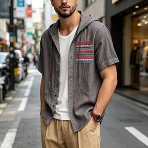 Close-up of a men's gray linen hooded short-sleeve shirt with bohemian chest pocket.