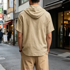 Detailed view of men's casual short sleeve hooded linen shirt in beige for summer street style.