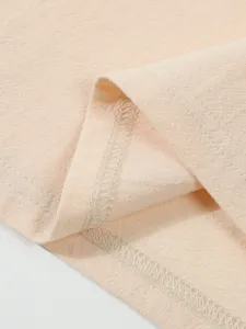 Close-up view of breathable linen fabric texture, fine stitching and detail craftsmanship.