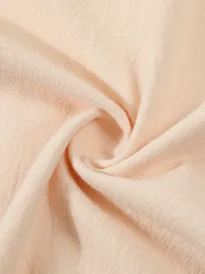 Close-up view of breathable linen fabric texture, soft and comfortable summer apparel detail.