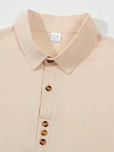Close-up view of men's casual cotton linen polo shirt collar and tortoiseshell buttons.