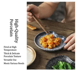 Close-up detail of a textured ceramic snack dish with Japanese appetizers on a rustic wooden table