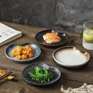 Set of elegant Japanese style ceramic snack plates for serving sushi and appetizers