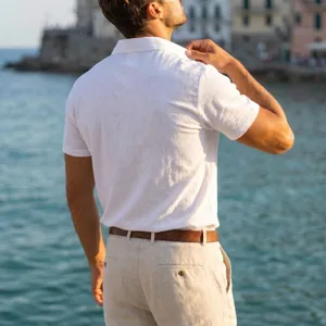 Outdoor lifestyle detail view of breathable linen short sleeve polo shirt for men vacation style.