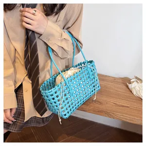 Summer stylish blue PVC woven handbag with drawstring inner pouch, chic beach resort tote bag.