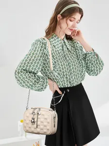 Details of the stylish spring grid soft leather crossbody bag with chain and cute bear pendant.