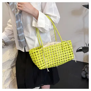 Summer PVC woven handbag for women, chic hollow mesh design with drawstring inner pocket.