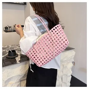 Summer pink PVC woven beach bag with inner pouch, stylish large capacity vacation handbag.