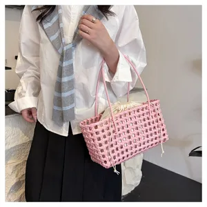 Stylish pink PVC woven tote bag for women, large capacity beach picnic handbag ideal.
