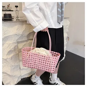 Summer pink PVC woven basket bag with drawstring inner pouch, stylish beach tote handbag.