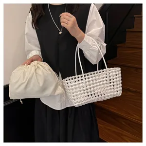 Summer white woven PVC tote bag with drawstring inner pouch, stylish beach and picnic handbag.