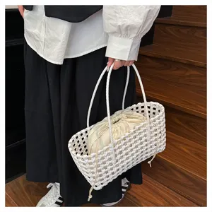 Detail shot of the white PVC woven handbag featuring a beige drawstring inner pouch, stylish texture.