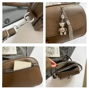 Brown leather crossbody bag detail, vintage shoulder purse with bear charm and tassel.