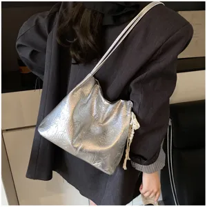 Metallic silver slouchy shoulder bag, casual versatile everyday commuting tote for women.