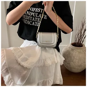 Silver metallic crossbody small square bag with chain strap for women, stylish detailed view.