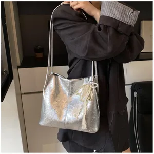 Stylish silver metallic tote shoulder bag for women, large capacity daily casual handbag.