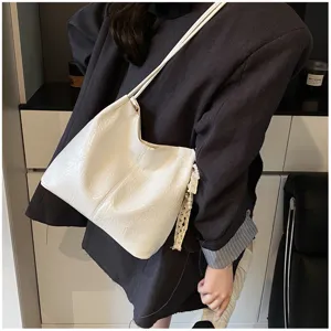 White slouchy shoulder bag detail, casual PU leather hobo tote with delicate lace pendant for daily commute.