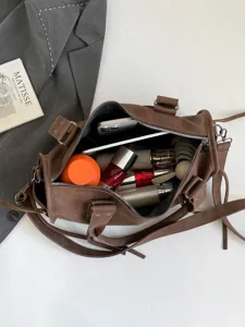 Retro large capacity crossbody bag for women, stylish brown shoulder tote bag for daily commute.
