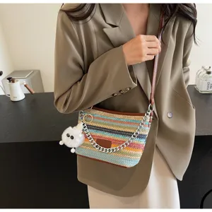 Women colorful straw woven crossbody bag, summer casual bucket handbag with metallic chain.