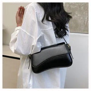 Chic retro solid color shoulder bag for women, minimalist black crossbody design detail view.