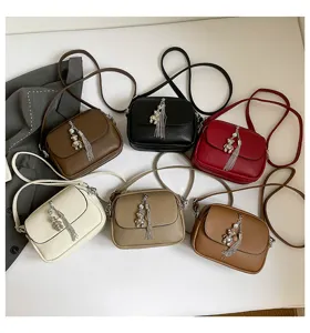 Detailed view of six colorful crossbody bags featuring cute tassel and bear pendants.