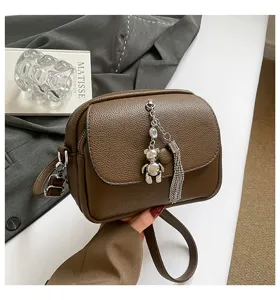 Brown leather crossbody bag with tassel and cute bear pendant for women casual daily use